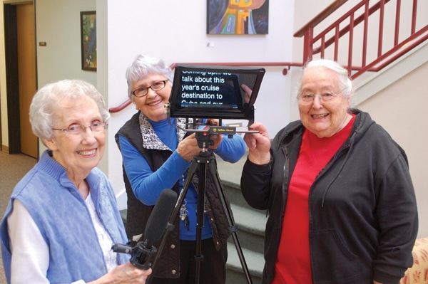 Three women with a broadcast camera
